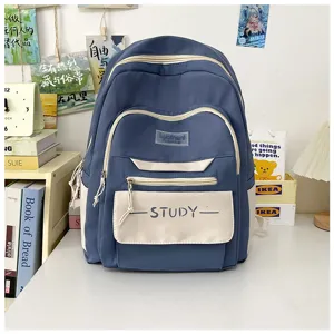 Close-up detail of the casual blue and white dual-pocket student school backpack.