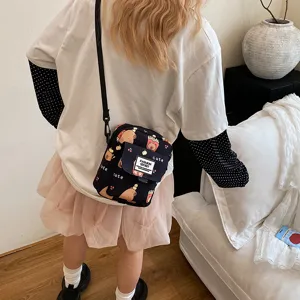 Cute cartoon capybara print canvas crossbody bag for women, stylish student small shoulder bag.