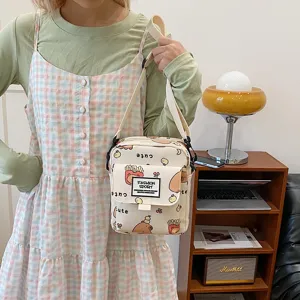 Canvas cross-body bag cute cartoon print shoulder messenger bag for women and students.