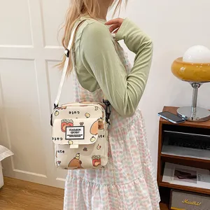 Canvas crossbody bag with cute cartoon prints, perfect for daily casual use and students.
