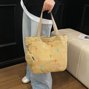 Casual canvas tote bag for women, large capacity shoulder bag with small coin purse, stylish.