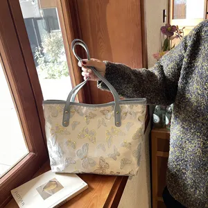 Detailed view of women casual butterfly jacquard tote bag large capacity shoulder handbag.