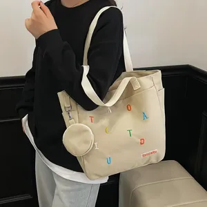 Canvas tote bag with cute embroidered letters and matching coin purse for daily casual use.