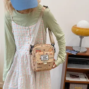 Cute cartoon capybara print canvas crossbody bag for women, casual student shoulder bag.