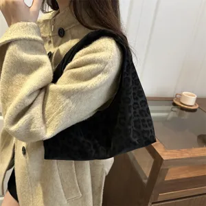 Close-up view of the chic black leopard print shoulder bag for daily casual fashion.