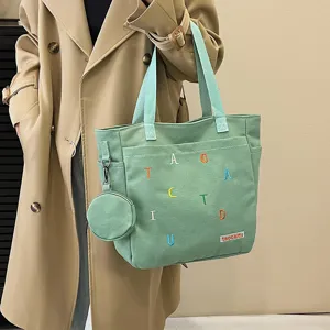 Light green canvas tote bag for women, large capacity shoulder bag with embroidered letters.