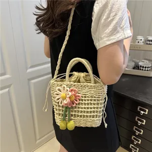Chic woven bucket shoulder bag for women, sweet floral accent, summer crossbody bag.