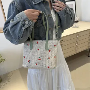 Summer straw woven tote bag with cherry embroidery, green top handle, casual travel handbag.