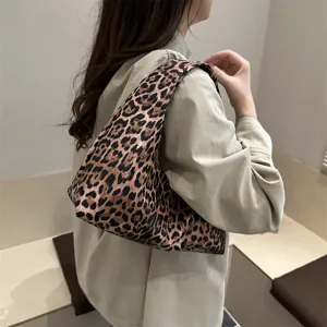 Leopard print slouchy shoulder bag detail showing stylish casual hobo handbag texture.