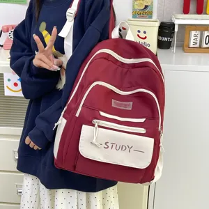 Korean style minimalist waterproof school backpack for students, large capacity casual daypack.