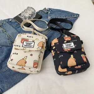 Cute cartoon capybara print canvas crossbody bag casual shoulder bag for women and students.