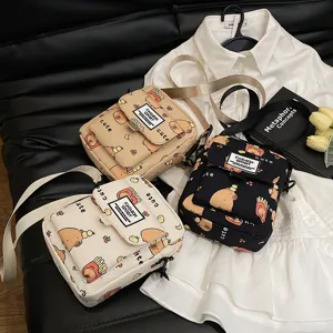 Canvas crossbody bag with cute capybara print, stylish small shoulder bag for women and girls.