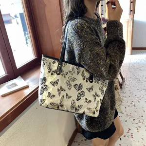 Women casual large capacity tote bag with elegant butterfly jacquard pattern for daily commute.