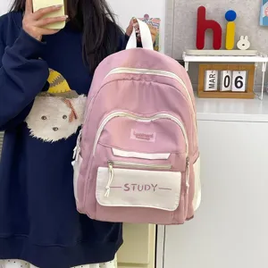 Korean style large capacity casual student pink and white school backpack with front pocket.