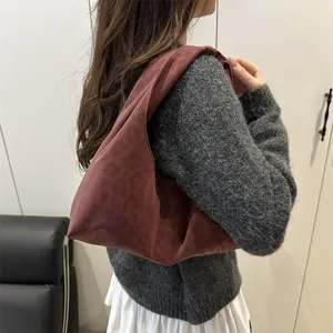 Soft slouchy hobo shoulder bag with subtle leopard print, casual everyday fashion handbag.