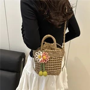 Women straw woven bucket bag summer sweet floral design single shoulder crossbody tote bag.