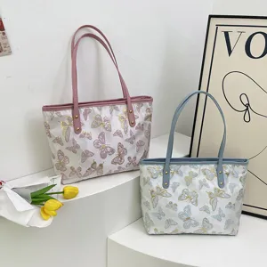 Women casual butterfly jacquard tote bag large capacity shoulder handbag for daily commute.