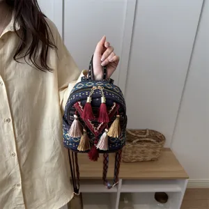 Ethnic woven mini backpack for women, cute casual tassel small backpack detailed view.