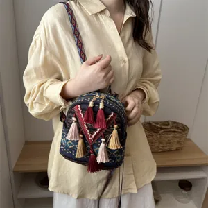 Boho style mini backpack for women with colorful tassels and straps for casual daily wear.