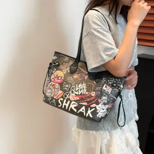 Black graffiti tote bag with cute bear print, large capacity canvas shoulder bag for women daily commute.
