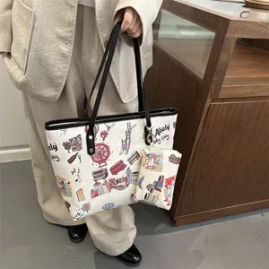 Detailed view of the large capacity tote bag featuring urban doodle print and matching pouch.