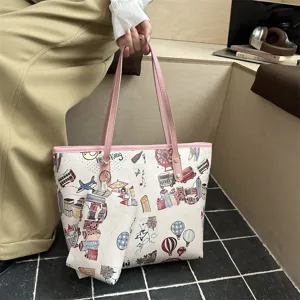 Stylish graffiti print tote bag with matching pouch, large capacity casual shoulder bag for women.