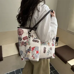 Detailed view of the large capacity canvas tote bag with pouch featuring cute cartoon doodle prints.