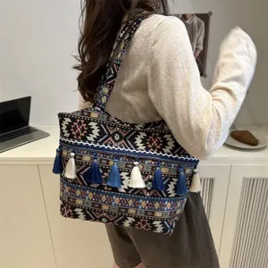 Bohemian retro ethnic embroidered tote bag with stylish tassels for women daily commute.