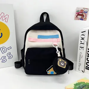 Cute cartoon kids backpack with bear pendant, stylish lightweight school bag for students.