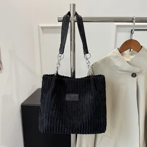 Black corduroy tote bag with metal chain strap and leather handle, large capacity shoulder bag.