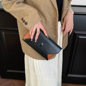 Elegant color-blocked women clutch bag, minimalist design for evening party and luxury daily commute.