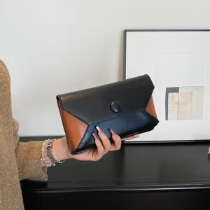 Elegant two-tone envelope clutch bag for women, stylish evening handbag for parties and events.