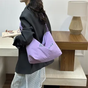 Stylish purple canvas tote bag with letter print, lightweight casual shoulder bag for work.