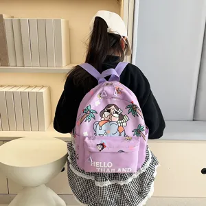 Purple cartoon print backpack detail showing back view with books and minimalist shelf background.