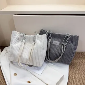 Stylish corduroy tote bag for women, large capacity shoulder bag with chain strap and elegant design.