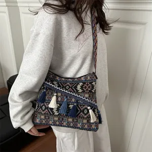Ethnic style canvas shoulder bag with colorful tassels, casual vintage messenger bag for daily use.