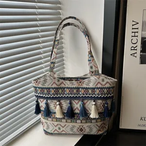 Retro woven ethnic style tote bag with tassels, stylish casual shoulder bag for women.