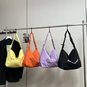Casual large capacity shoulder bag for women, lightweight tote with stylish pleated strap.