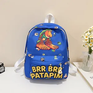 Detailed view of cute blue kids cartoon backpack with funny character print and bold lettering.