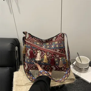 Ethnic style canvas shoulder bag for women, retro geometric pattern crossbody bag with tassels.