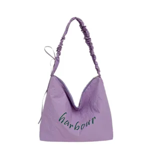 Casual purple shoulder bag with letter print, lightweight hobo tote for daily work and commuting.