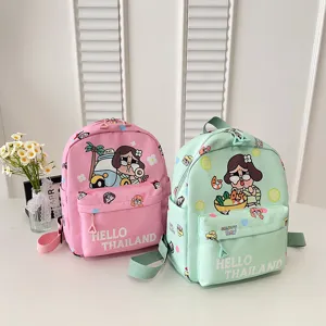 Detail view of cute cartoon print lightweight school backpack in pink and green colors.