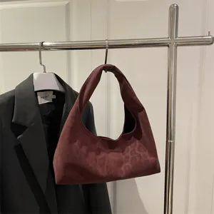 Burgundy leopard print hobo handbag detail shot, stylish slouchy PU leather shoulder bag.