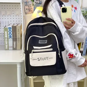Detail view of casual black and white student backpack with large capacity and stylish design.