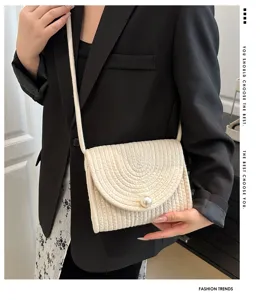 Handcrafted woven cotton linen crossbody bag with elegant pearl clasp, sweet style.