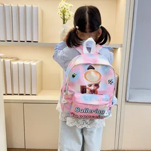 Cute pink gradient kids school backpack with cartoon coffee cup design for kindergarten students.