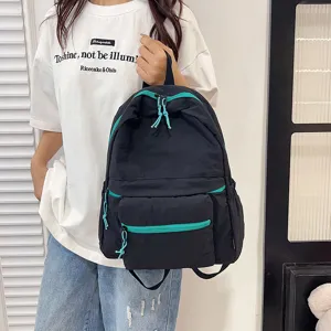 Casual minimalist black backpack with bright cyan zippers for daily student commuting.