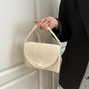 Handmade woven cotton linen small square handbag detail featuring a sweet pearl clasp closure.