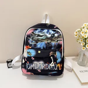 Detailed view of the children backpack with cool crocodile pilot print and front pocket text.