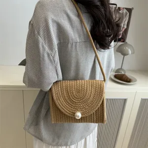 Handmade woven crossbody bag for women, sweet pearl envelope shoulder bag detail view.